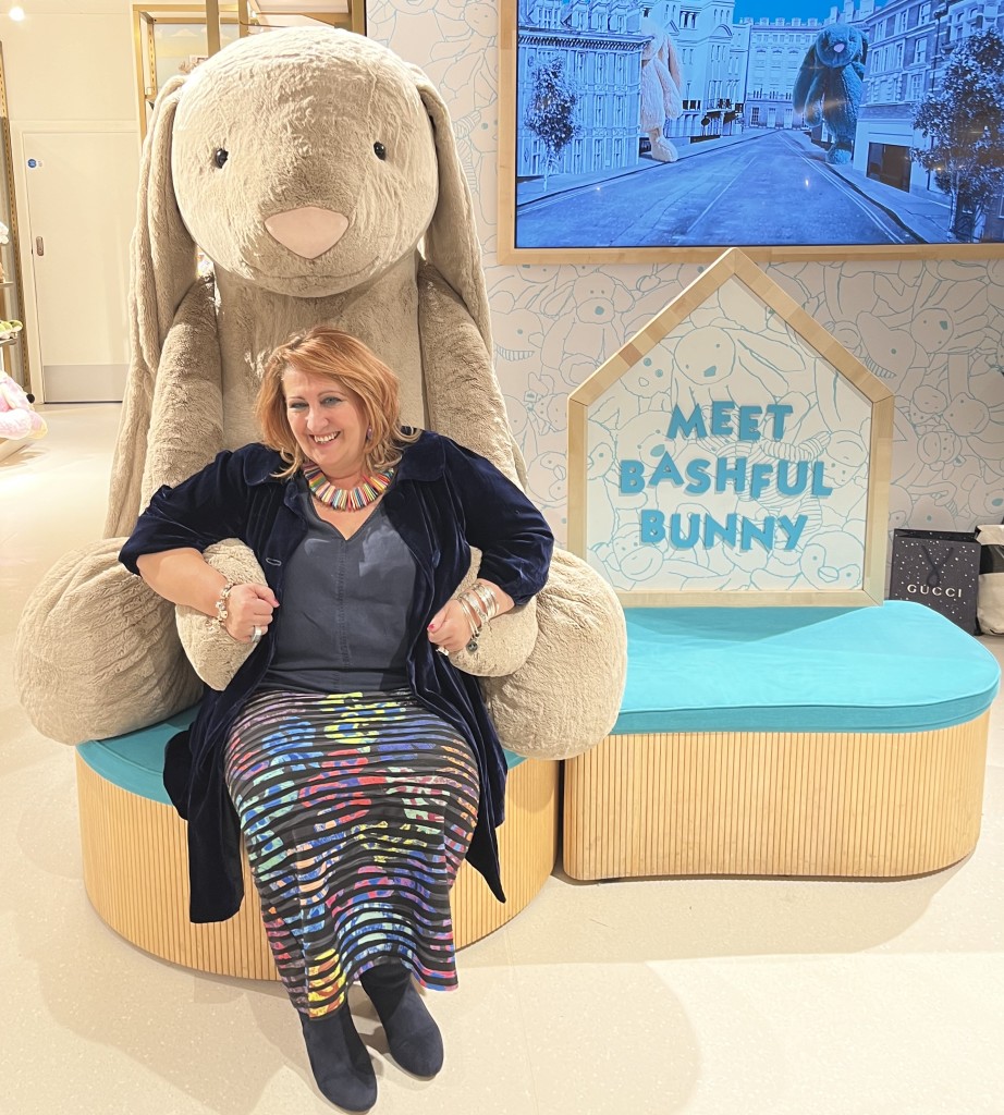 Above: Rosie Trow enjoying a Bashful Bunny hug in the Jellycat offices