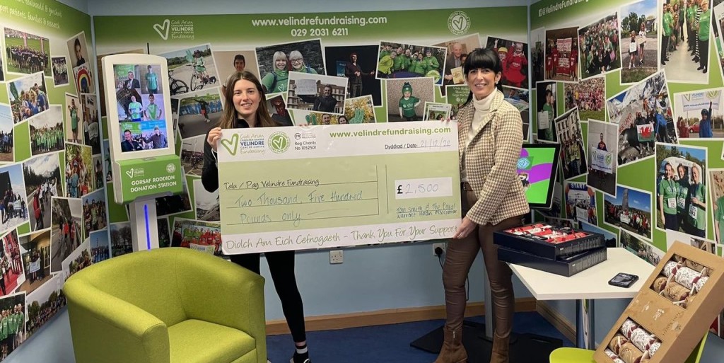 Above: IG’s Katie Brickle (right) presents Velindre’s cheque and crackers
