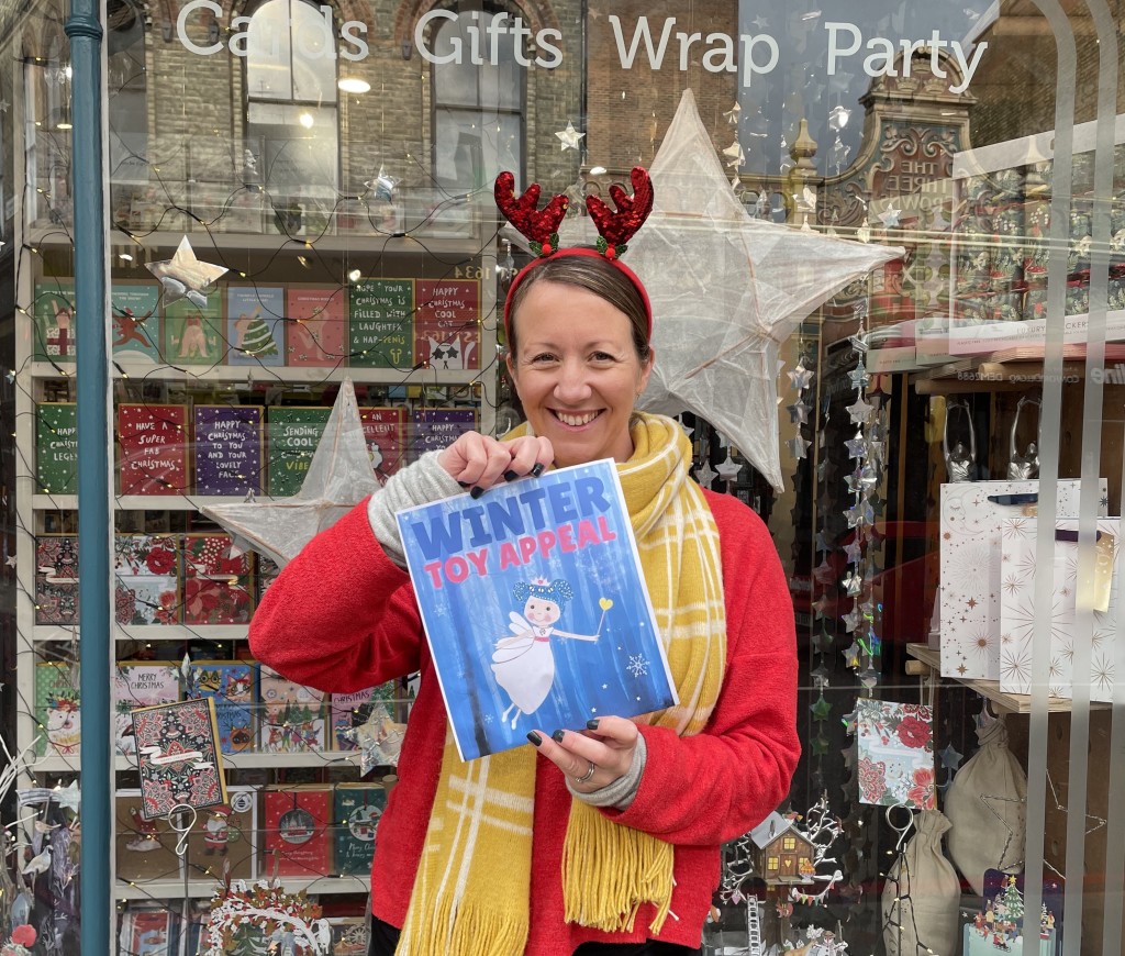 Above and top: Heidi promoting the Winter Toy Appeal where packs of cards sold in Earlybird raised £250
