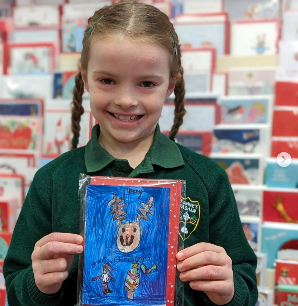 Above: One of the delighted young winners of Stationery Supplies’ Design A Christmas Card competition
