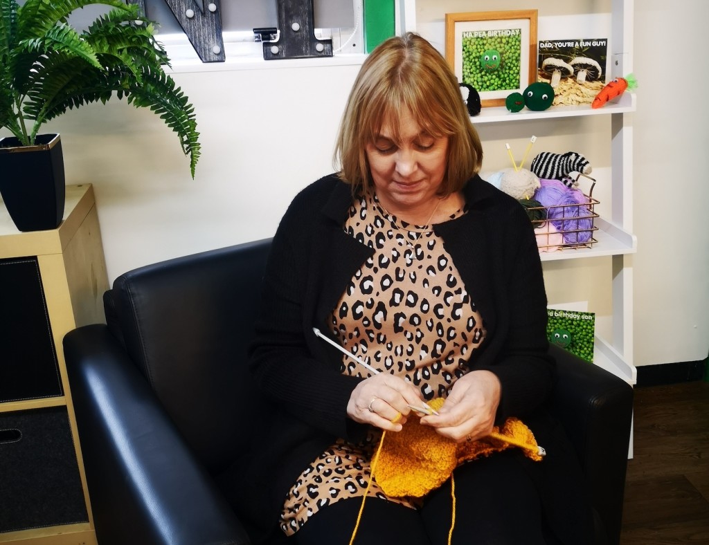 Above and top: Debbie concentrating on her knitting