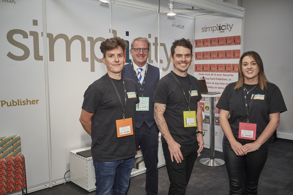 Above: The Imaging Centre’s md Adam Short and ops director Jess Penfold at PG Live 2022 with new business manager Simon Davis (left) and customer services manager Alan Miller