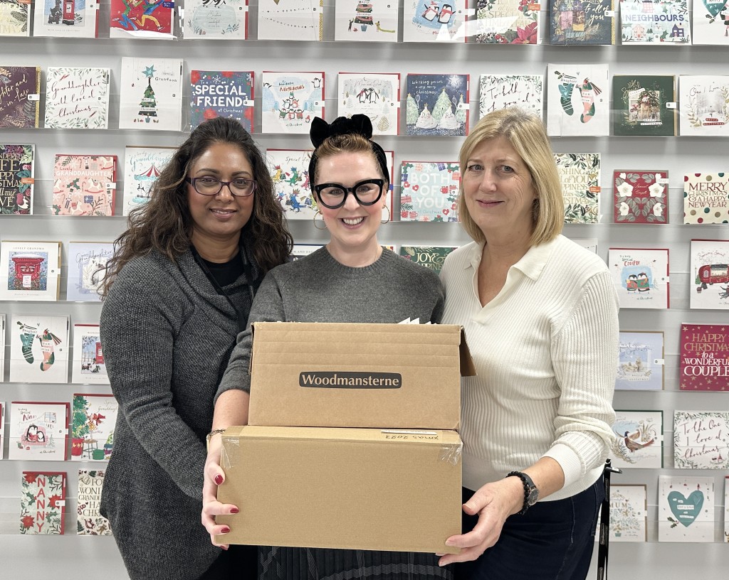Above: Having donated to Crisis, Kate Leach (centre) was more than willing to join colleagues Beena Sarangdhar and Theresa Devereux in parcelling up Christmas cards for the charity project