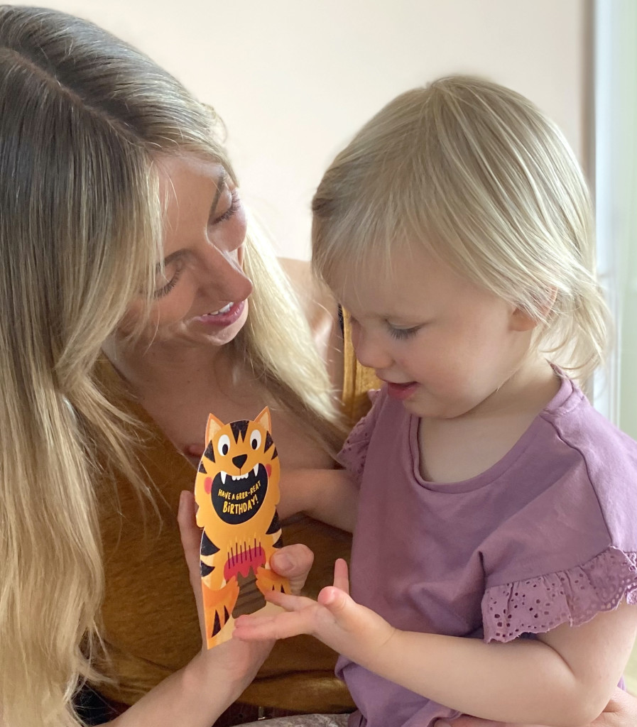 Above: Phoebe may only be 2½ but she already knows mum Sarah Jackson’s tiger card is her favourite Stormy Knight design
