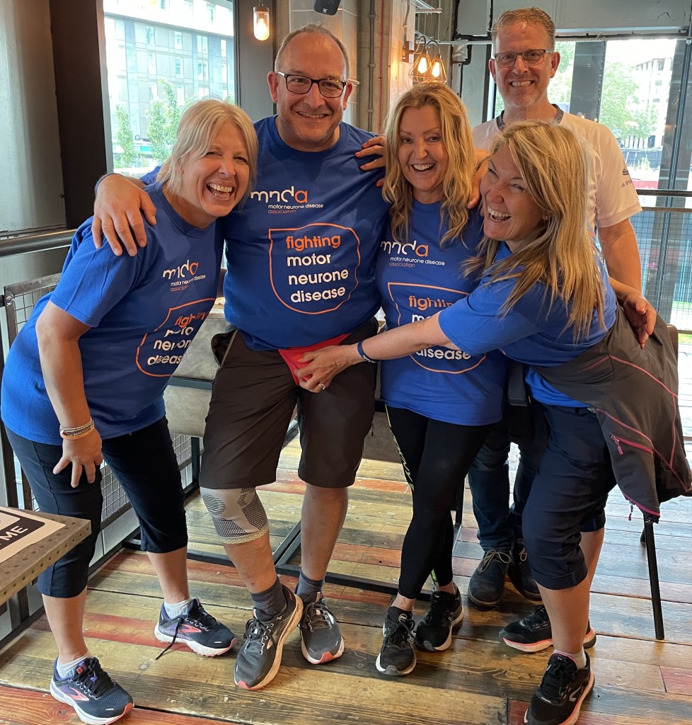 Above: Ian Bradley in his fundraising posing pouch at the end of the Cardgains’ Charity Challenge walk with (right-left) Hugs & Kisses’ Caroline and Jon Ranwell; Presentation’s Andrea Pinder and his wife and Rush Design founder Lorraine